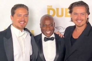 Cole and Dylan Sprouse reunite with Phill Lewis on the red carpet.