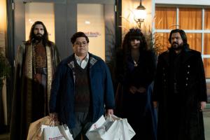 Group of vampires outside a building at night in What We Do in the Shadows