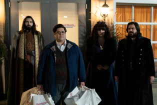 Group of vampires outside a building at night in What We Do in the Shadows